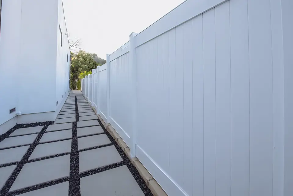 Vinyl privacy fence in backyard setting